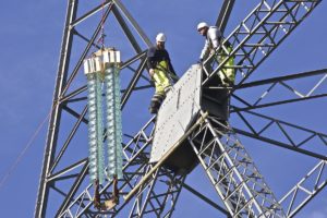 New insulators lifted into position